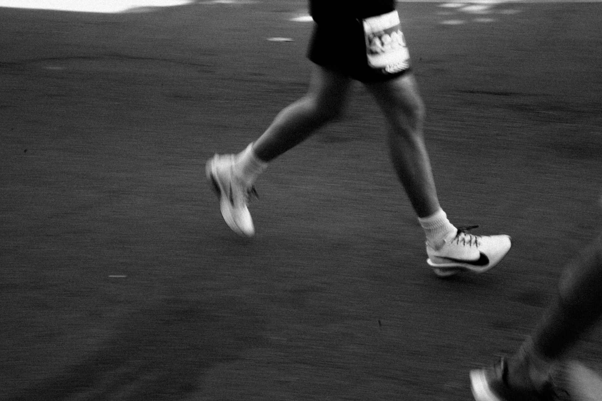 Gait Analysis Explained: Why It Matters for Every Runner and Walker Runner legs in mid-stride during a race