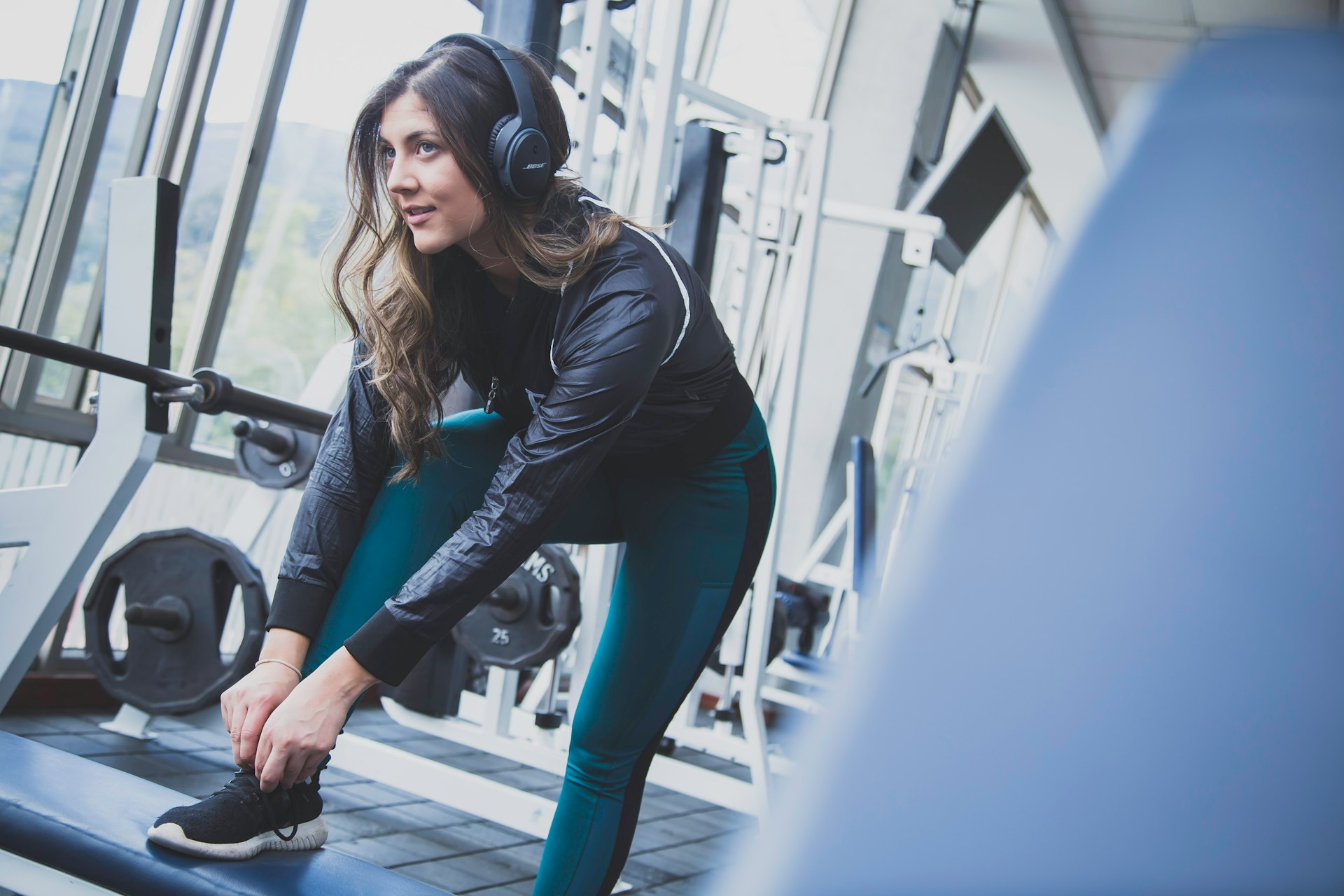Gait Analysis Explained: Why It Matters for Every Runner and Walker Woman tying her running shoe before heading out