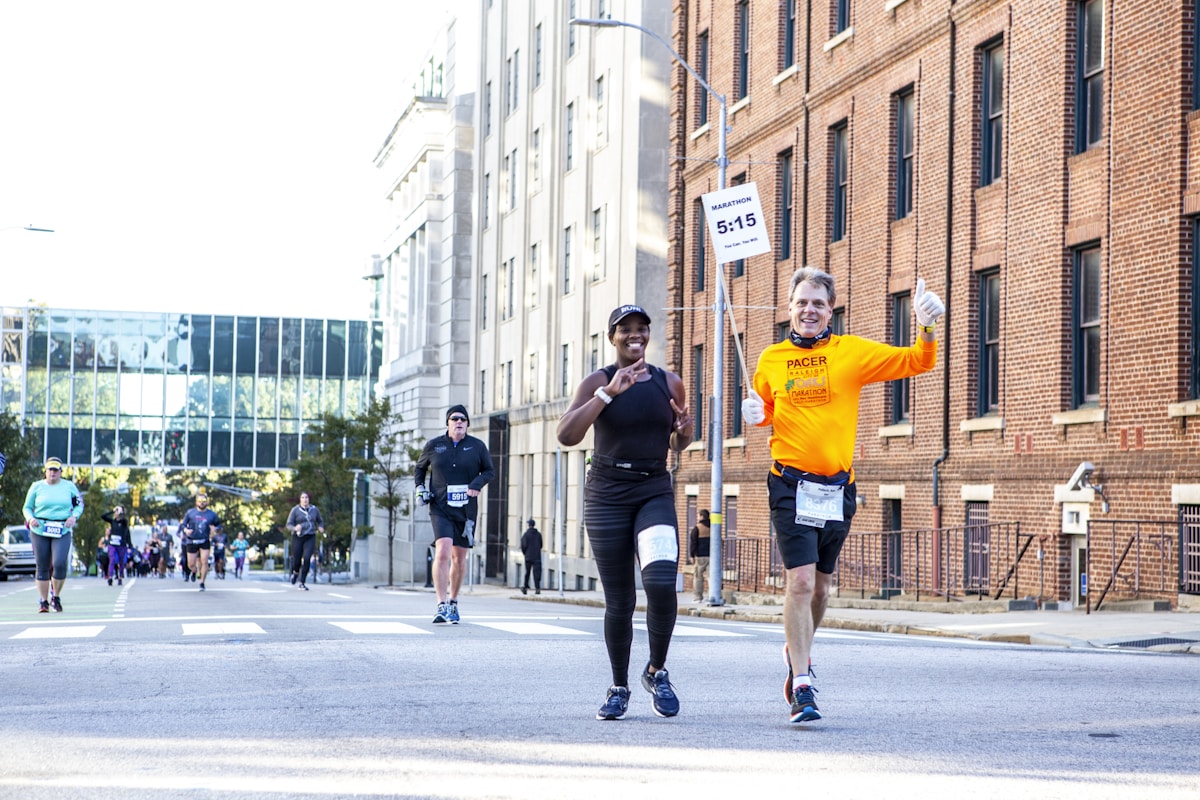 Man training for a marathon on an open road
