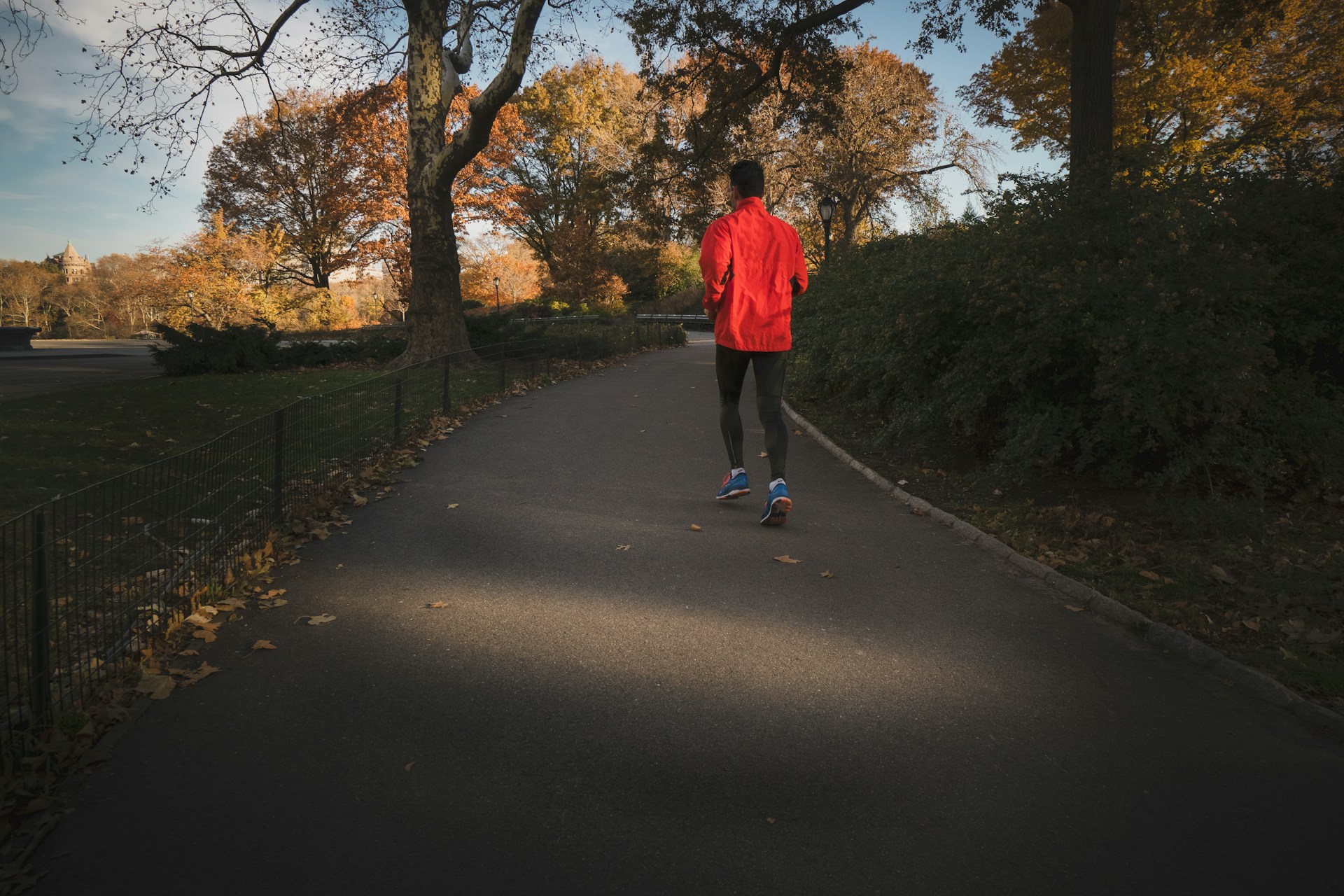Running After 50: How to Keep Logging Miles as You Age Person jogging near a park during the day
