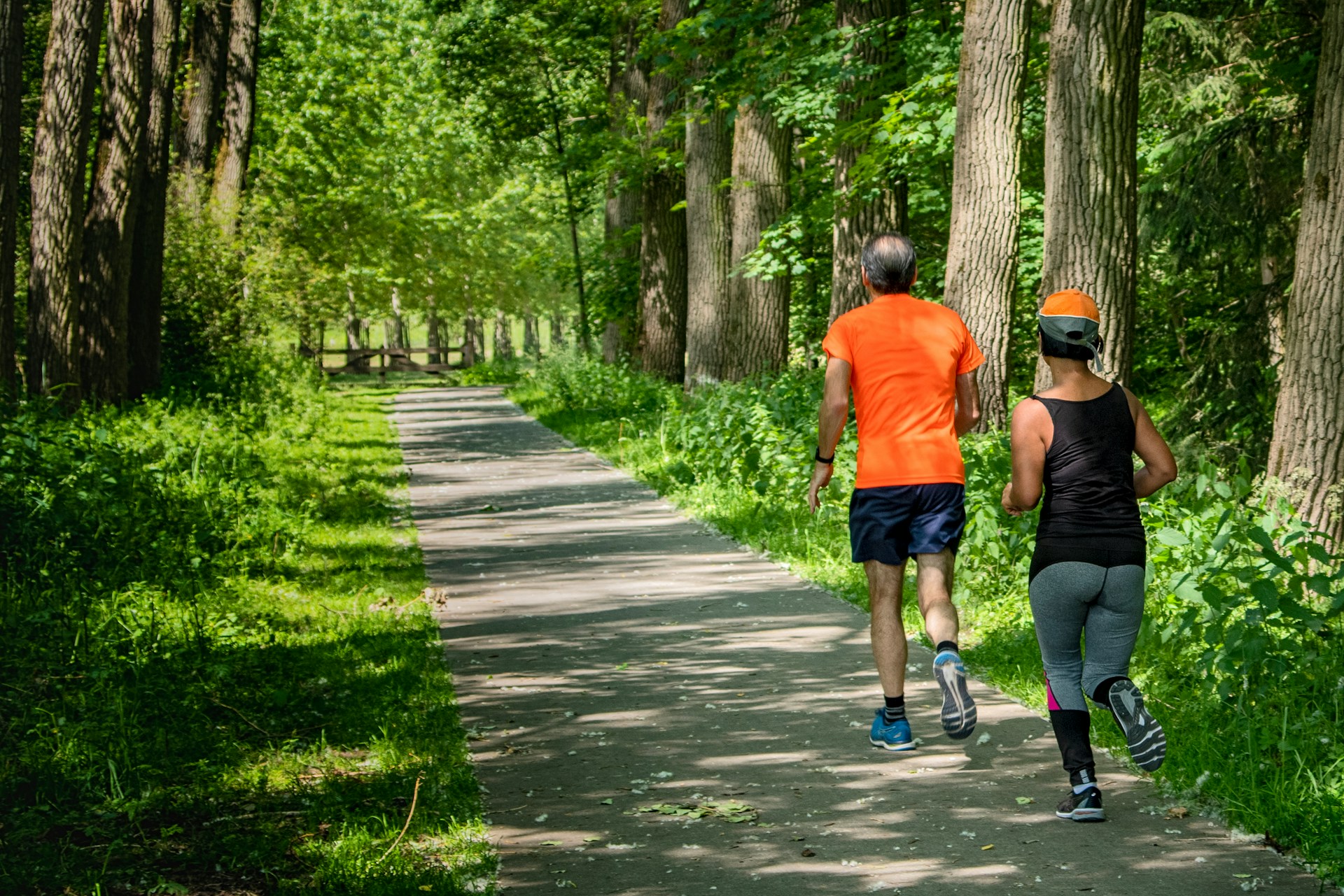 Running After 50: How to Keep Logging Miles as You Age Person walking on a pathway in athletic clothing